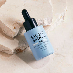 Eight Saints dropper dispensing serum showcasing lightweight texture and absorption