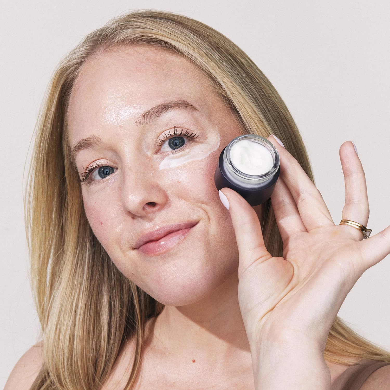 Cream texture swipe showing smooth retinol formula and instant hydration by Eight Saints