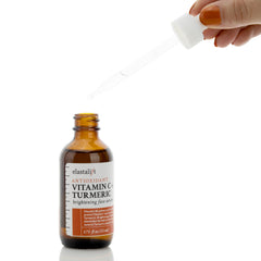 Elastalift flatlay with vitamin C and turmeric visuals indicating antioxidant support