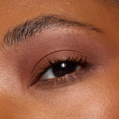 e.l.f. product in use applying shimmer to lid for enhanced dimension