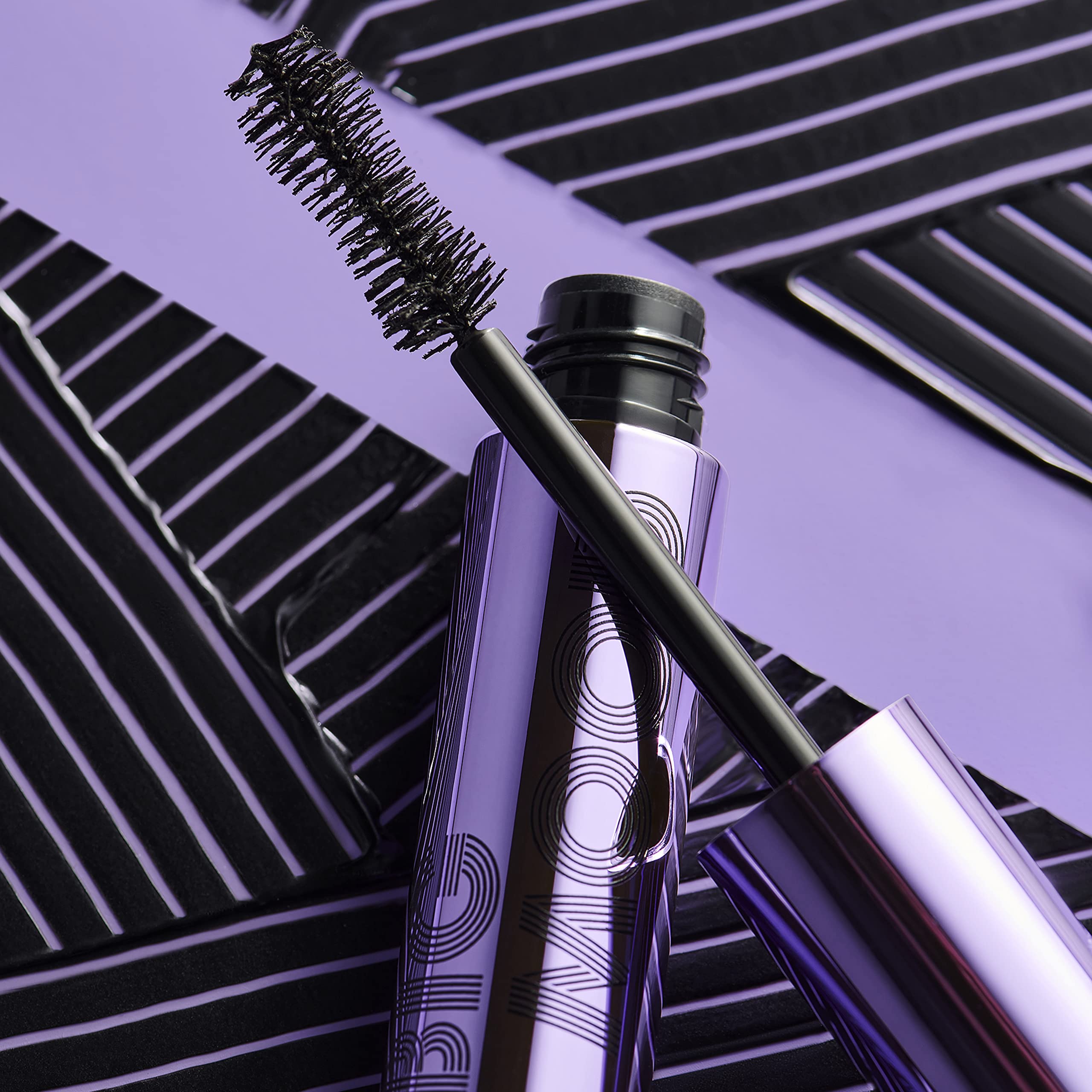 e.l.f. Big Mood Mascara texture swatch on skin showing creamy black formula benefit: smooth buildable coverage