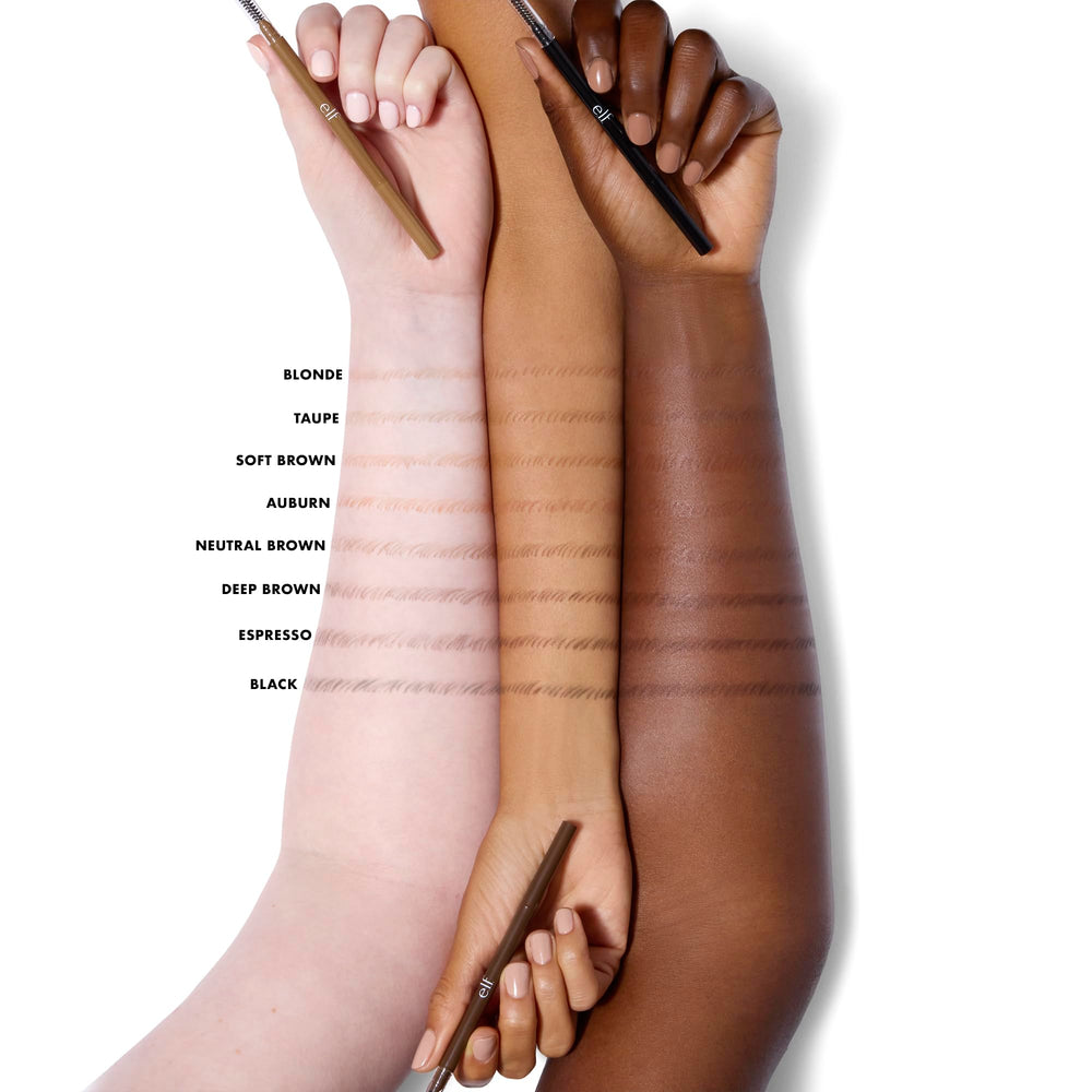 e.l.f. pencil held to show scale and ease of travel for on-the-go touch-ups