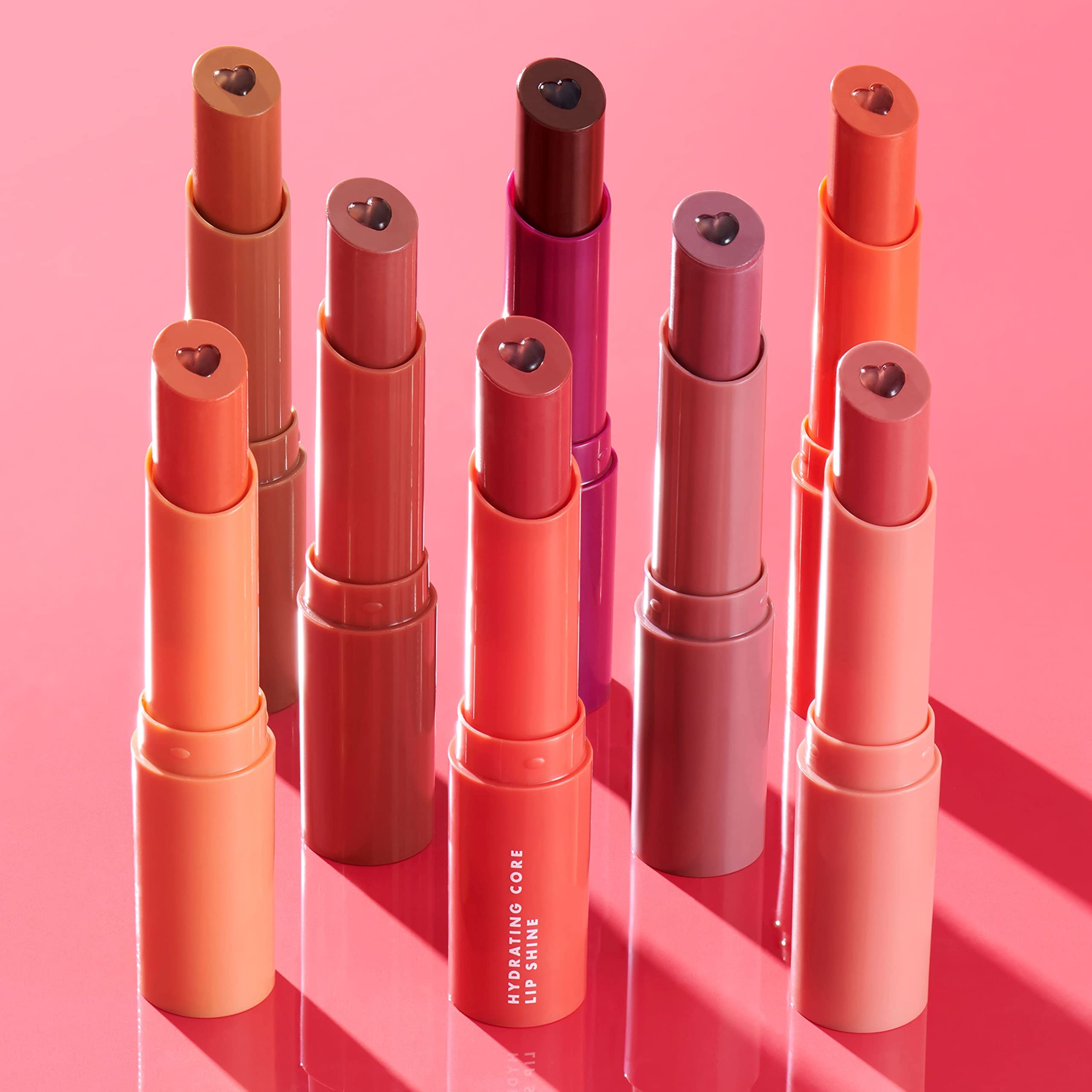 e.l.f. lip shine placed in handbag conveying on-the-go hydration benefit