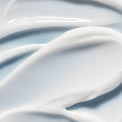 e.l.f. SKIN cream being gently tapped under eye showing smooth base for makeup benefit