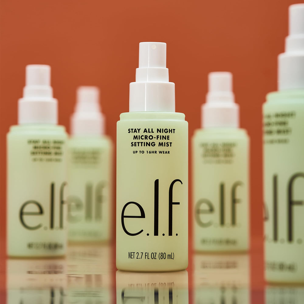 e.l.f. misting onto model to illustrate hydrating refresh and long wear benefit