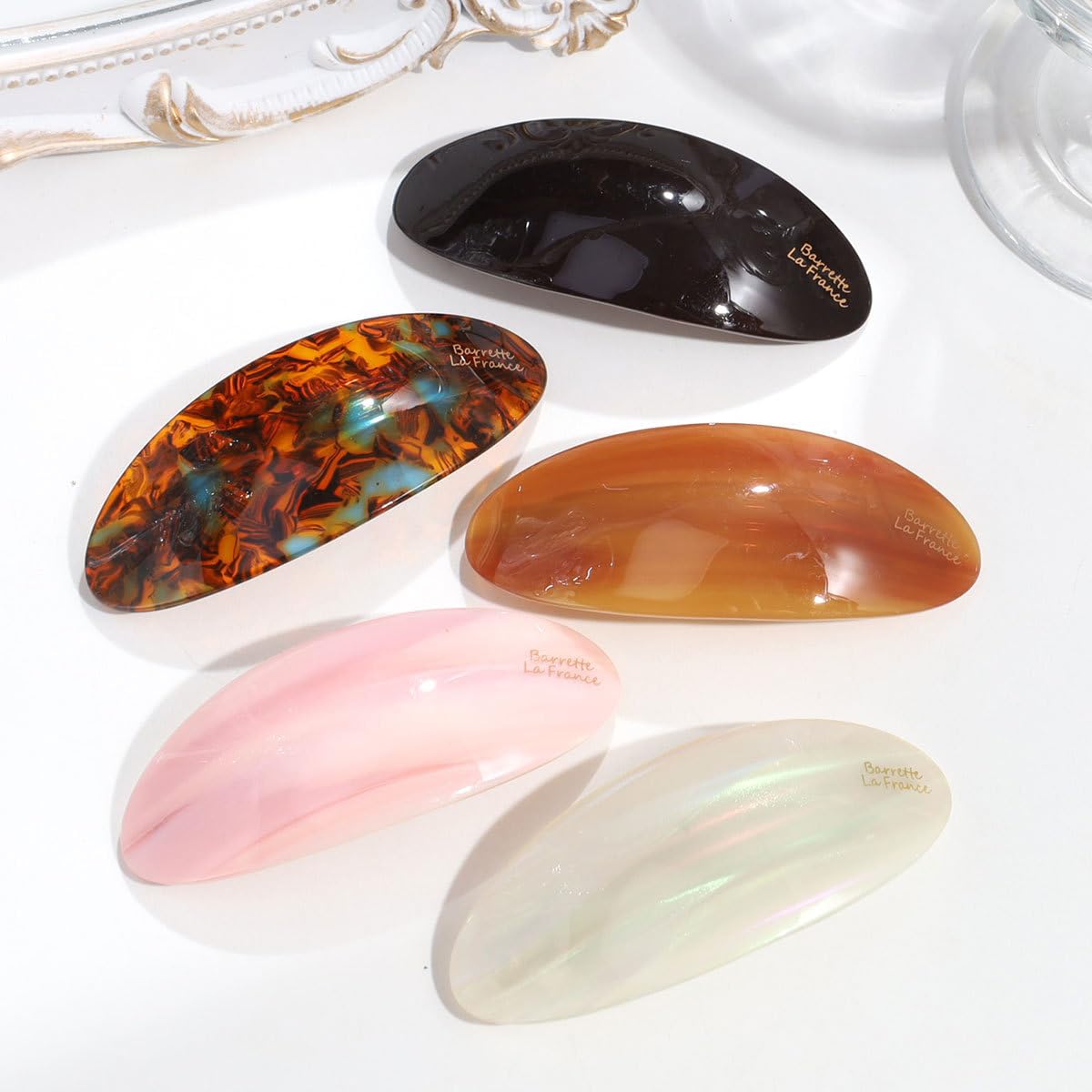 Eliongpu front view of four barrettes showing colors and glossy finish for versatile styling