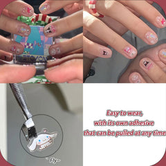 Emifunny finished manicure on hands showcasing cute decals and fun results