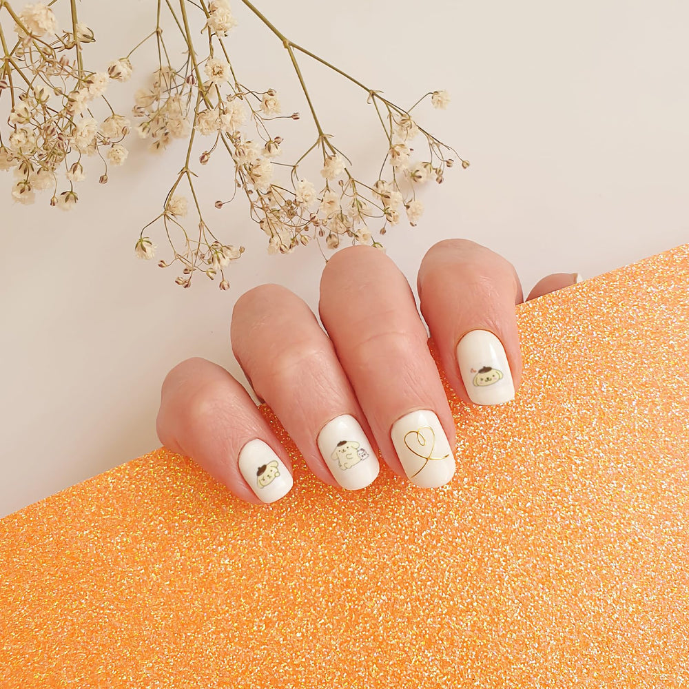 Emifunny stickers beside a finger for scale illustrating fit on small nails