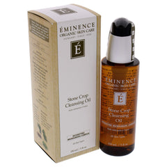 Eminence bottle beside stone crop and oils showing natural ingredients