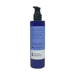 EO French Lavender lotion pouring from bottle demonstrating smooth texture for quick absorption