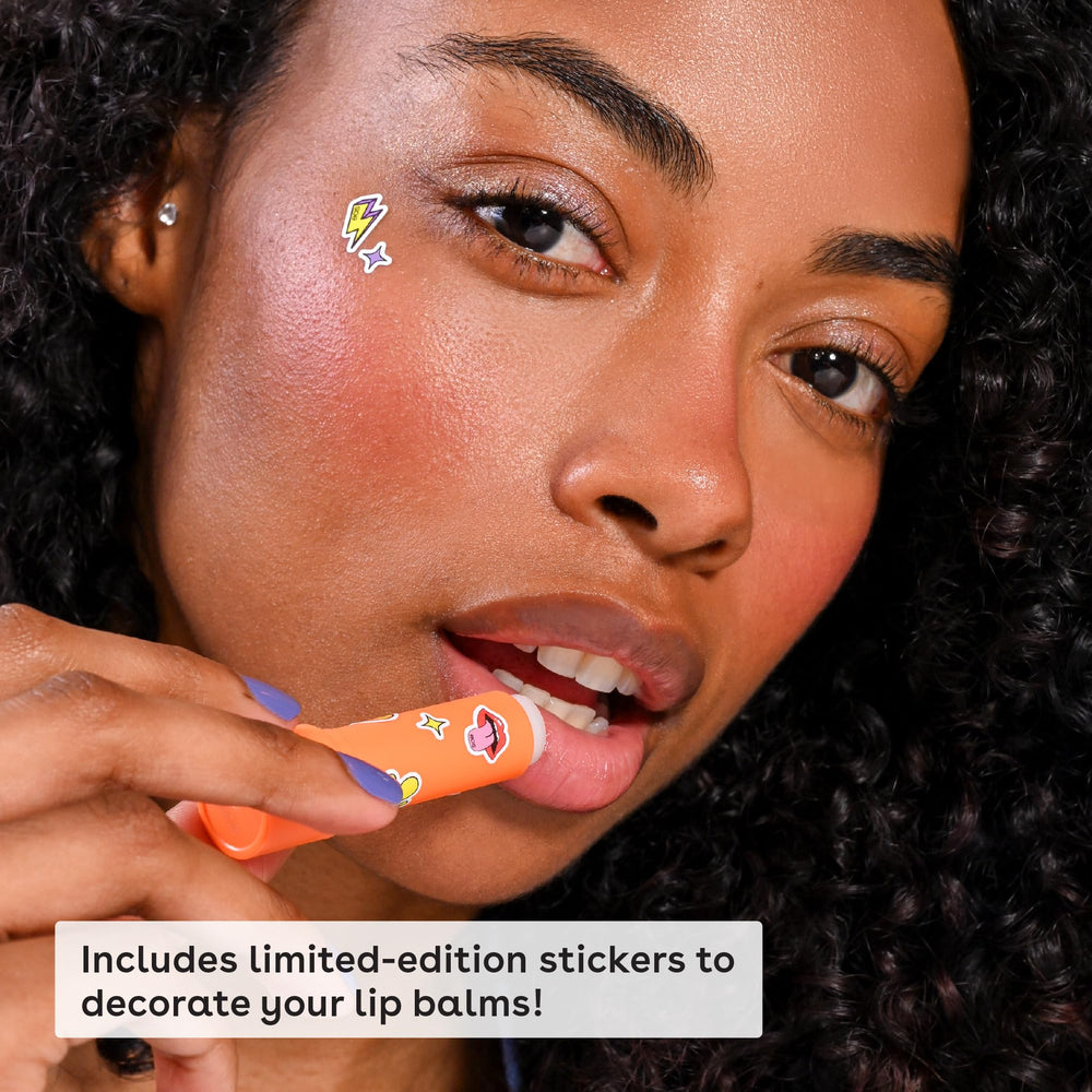 eos balms in hand to show scale and portable convenience for travel