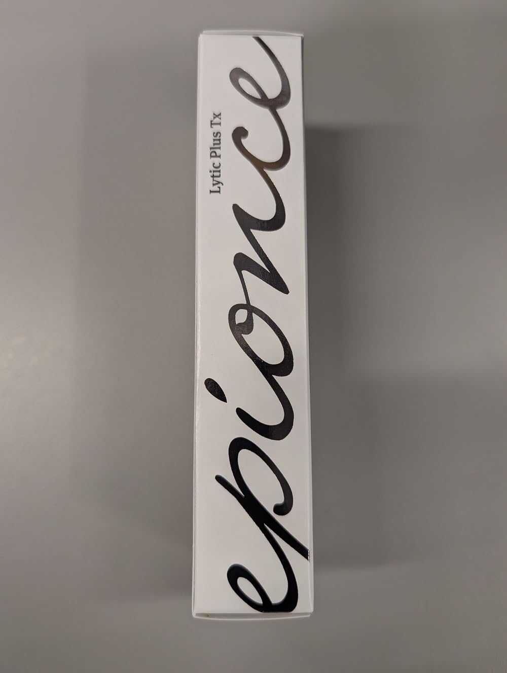 Epionce Lytic Tx bottle paired with Epionce cleanser and moisturizer for routine