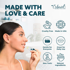Erbaid lip balm next to coin displaying compact travel-friendly size