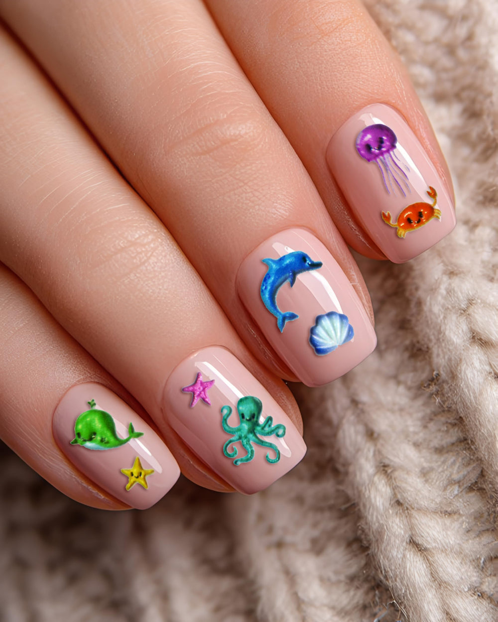 ERSHIXUN stickers applied on polished nails showing finished look for beach-ready manicure