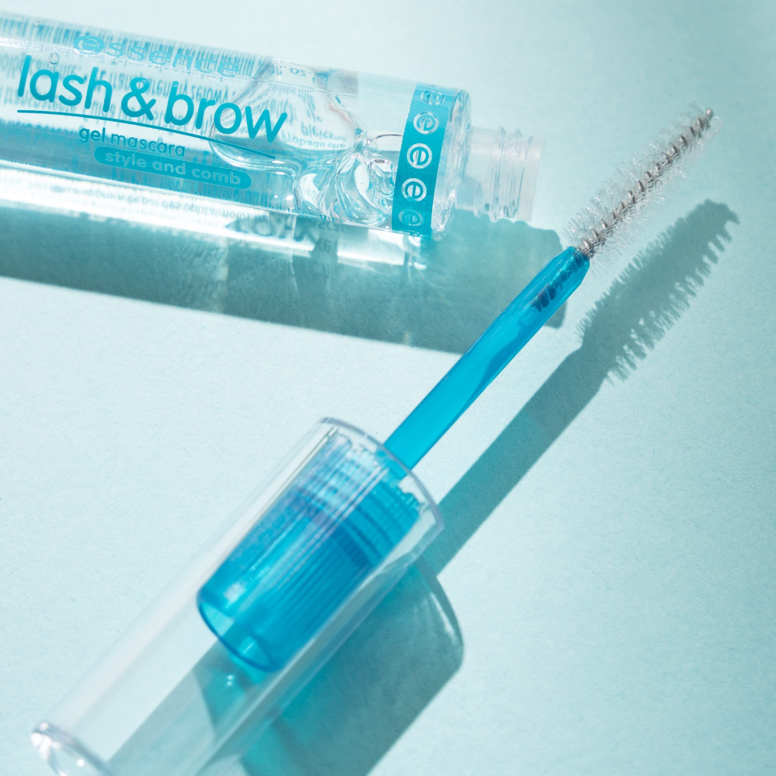 essence tube next to a ruler showing compact travel size and portability
