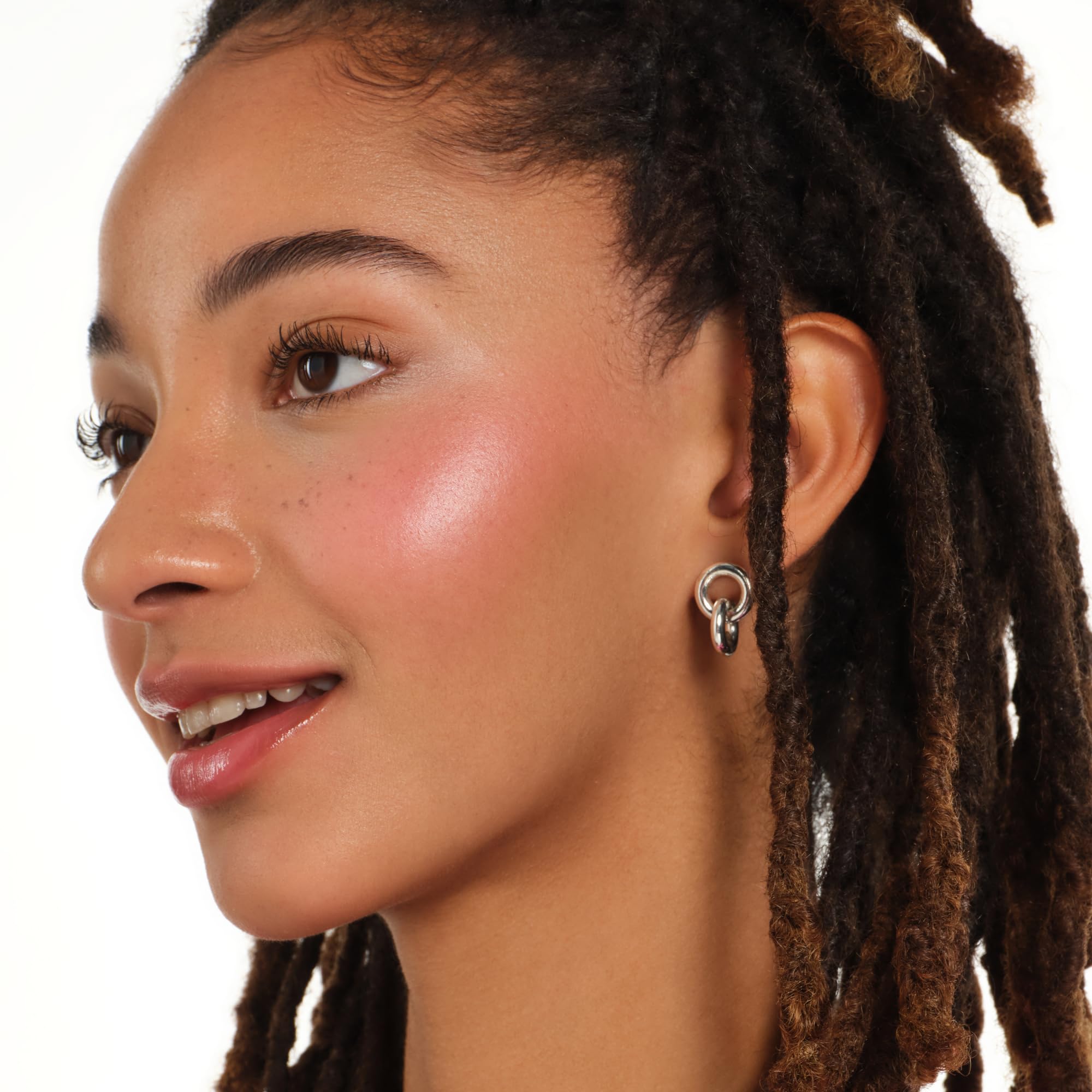 Essence Soft Baked Blush on model cheeks demonstrates natural berry glow and flattering finish