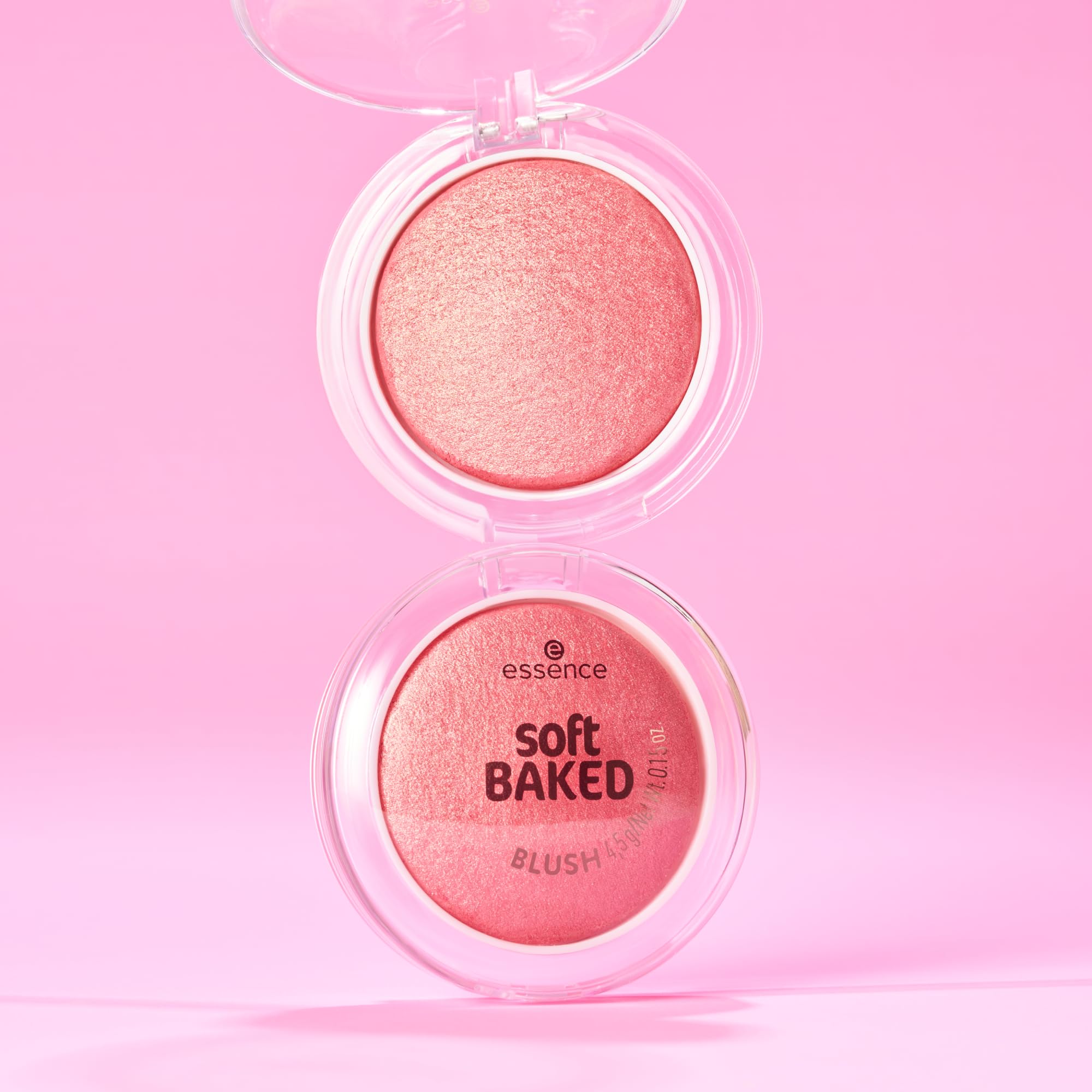 Essence Cosmetics compact next to hand showing product size and portability