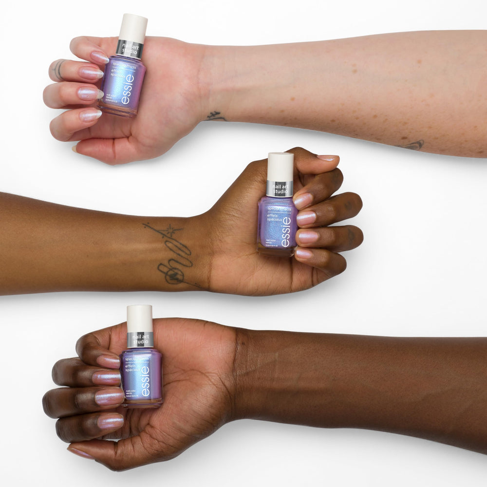 essie layered over black polish creating intense iridescent effect