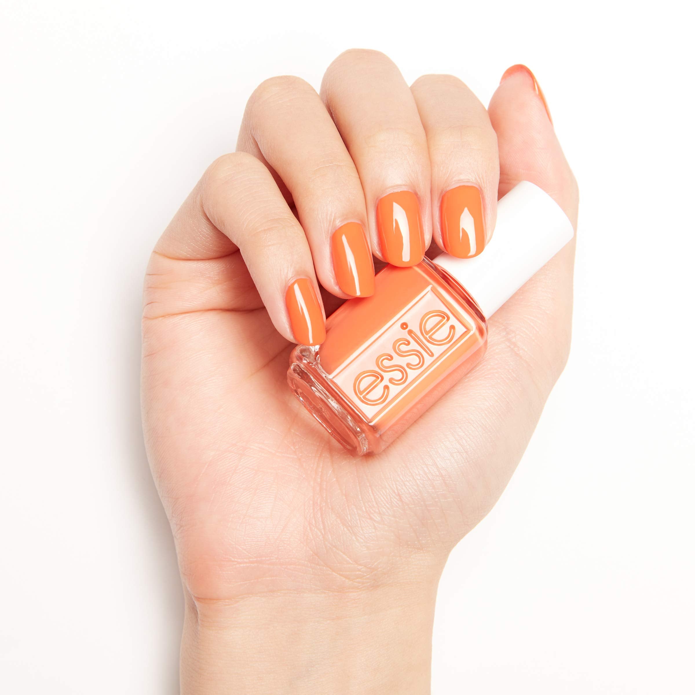 essie hand model wearing tangerine manicure illustrating polished look benefit
