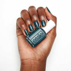 essie bottle beside cuticle oil highlighting complete nail-care routine