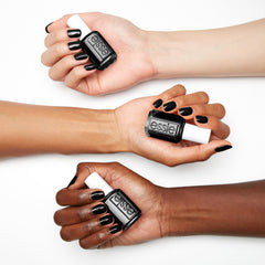essie Licorice nail swatch on hand demonstrating deep color and shine benefit
