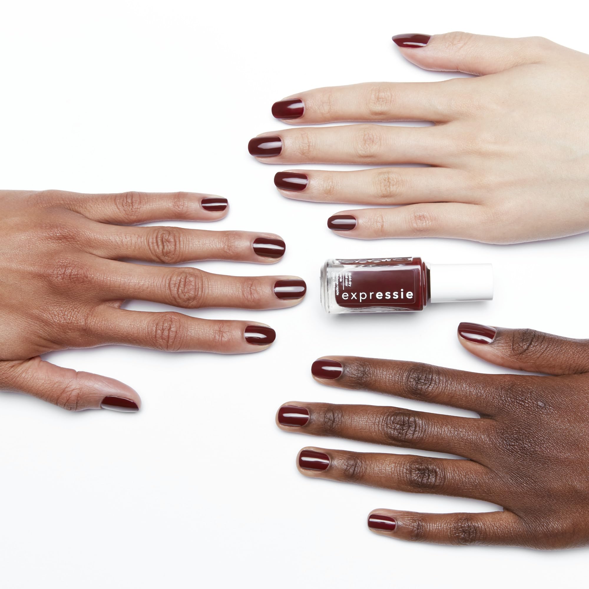 essie swatch on nails showcasing deep burgundy coverage and salon finish
