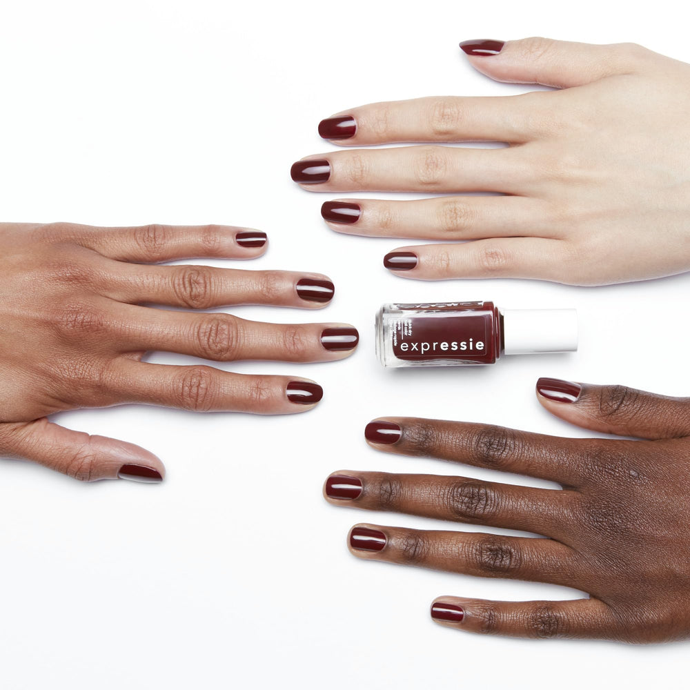essie swatch on nails showcasing deep burgundy coverage and salon finish
