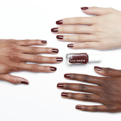essie swatch on nails showcasing deep burgundy coverage and salon finish