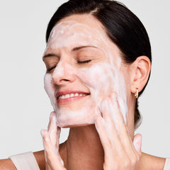 Estée Lauder cream being applied on hand illustrating easy spreadability benefit