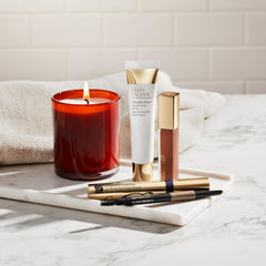 Estée Lauder spoolie brushing brows in use to blend and set benefit