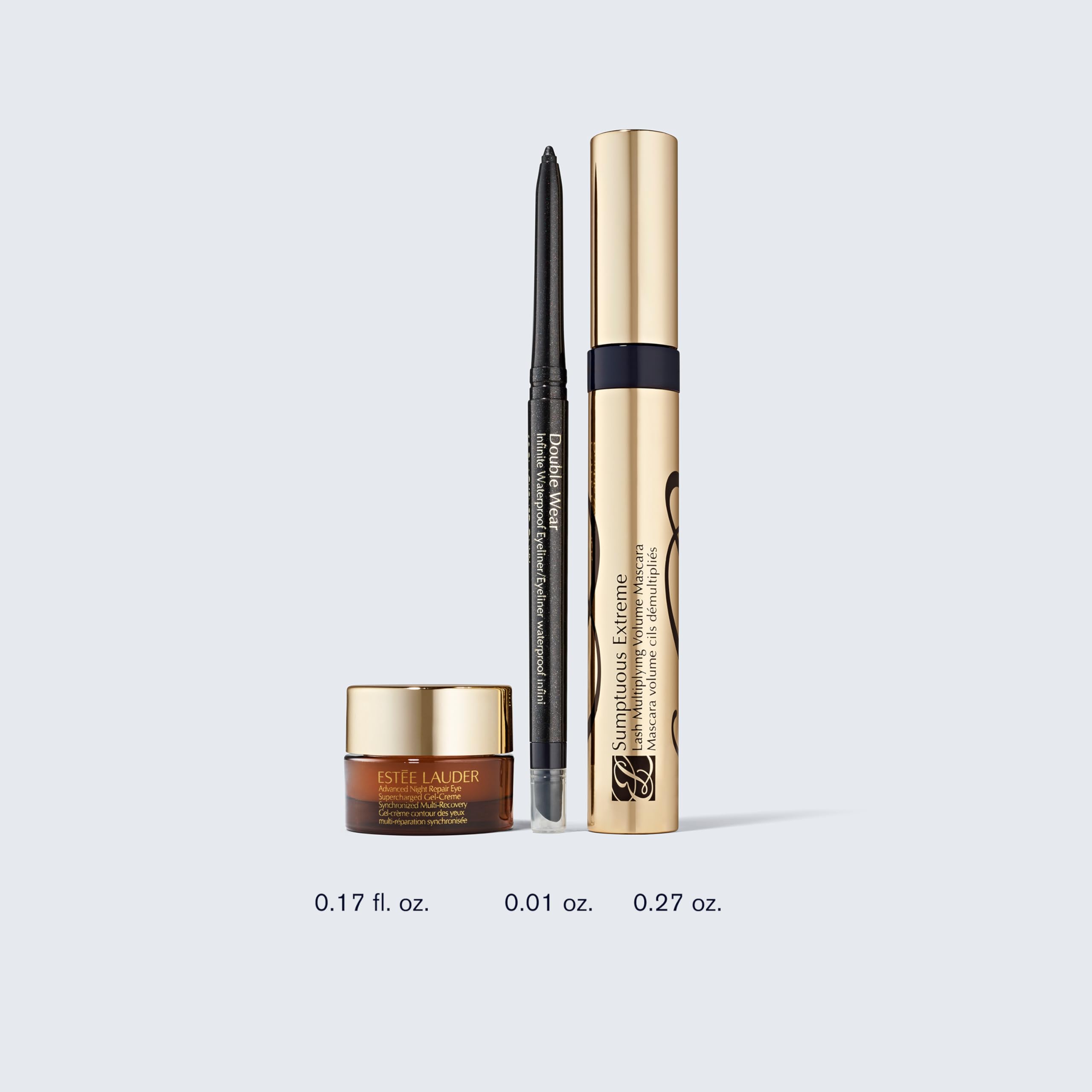 Estée Lauder products arranged to show scale and full‑size versus travel‑size contents