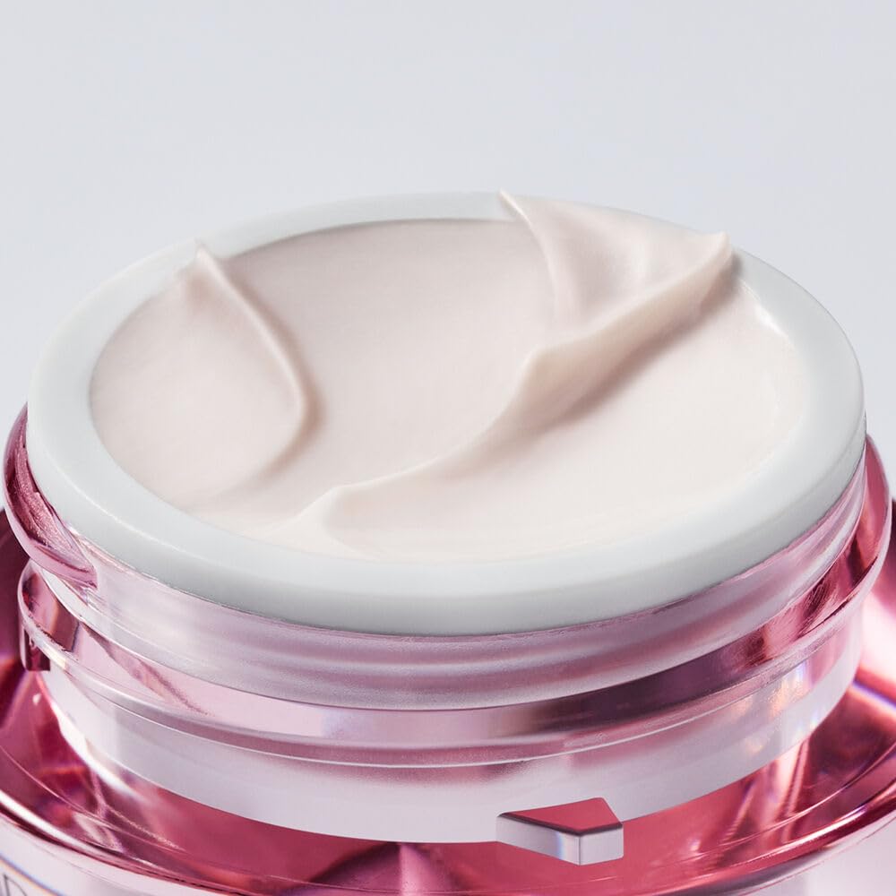 Estée Lauder cream on fingertip ready to apply for smoother eyes