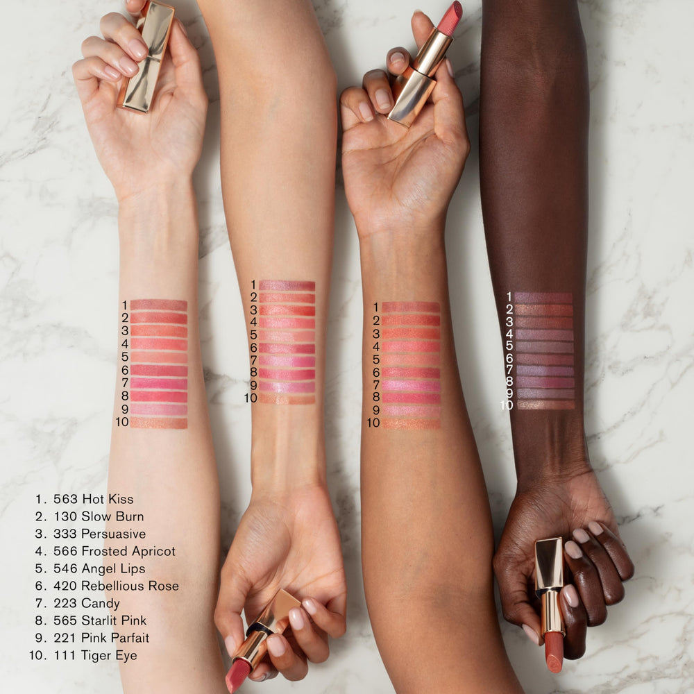 Estée Lauder lipstick held in hand showing scale benefit: compact travel-ready size