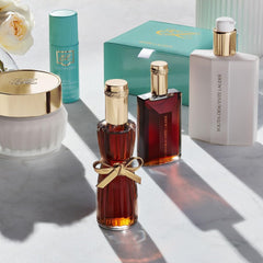 Estée Lauder Youth‑Dew application on arm demonstrating fast absorption benefit