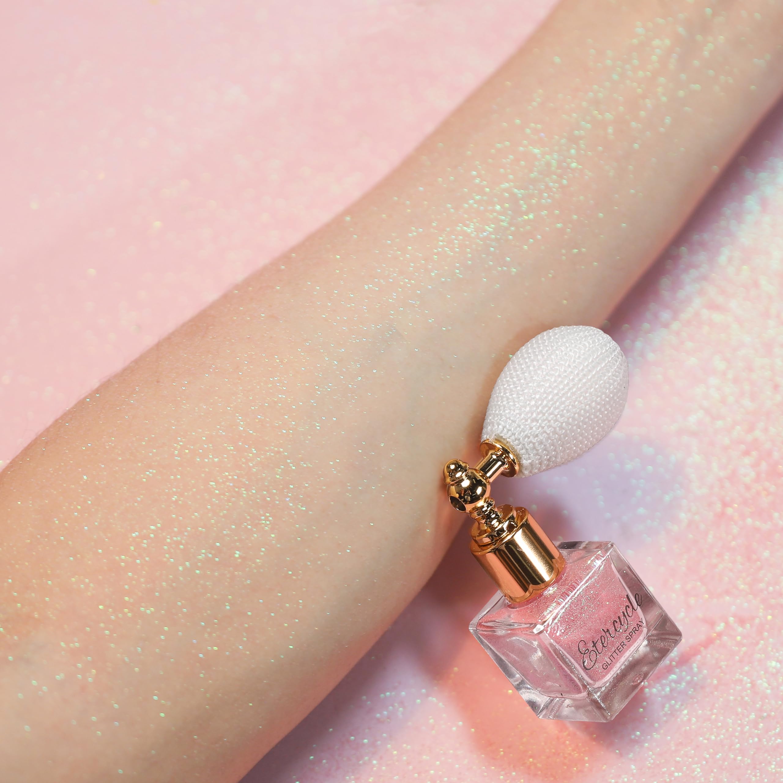 Etercycle glitter texture loose pink powder showing fine shimmer and blendability