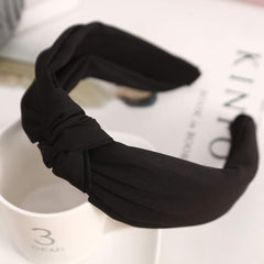 Etercycle headband next to ruler showing compact, travel-friendly size