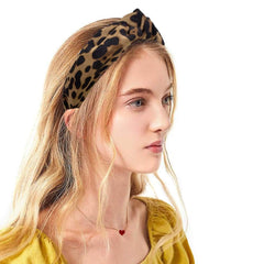 Etercycle headbands held in hand to show scale and lightweight portability