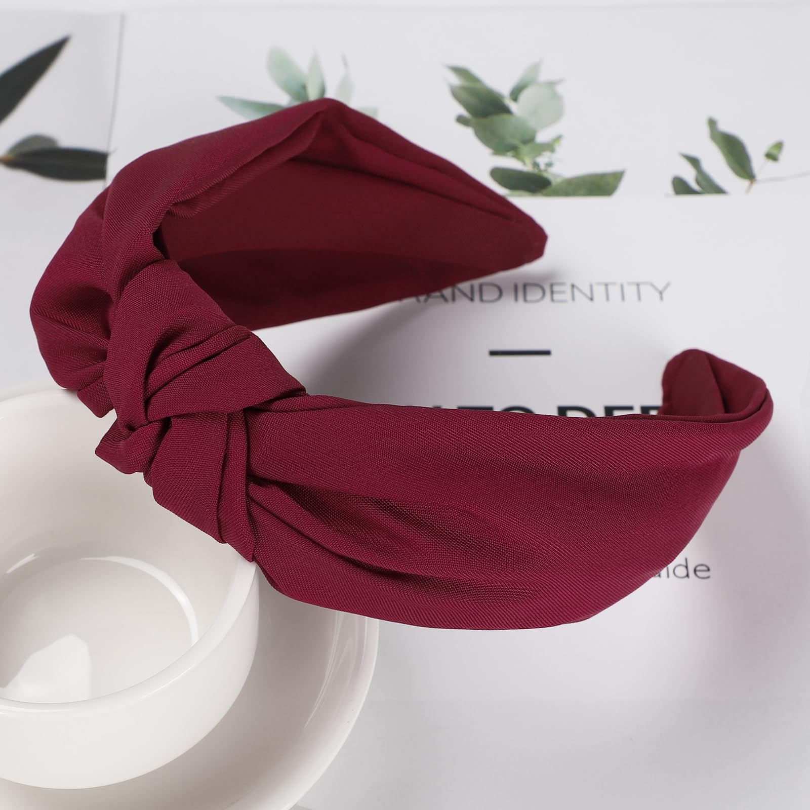 Etercycle headband next to ruler showing compact size for travel