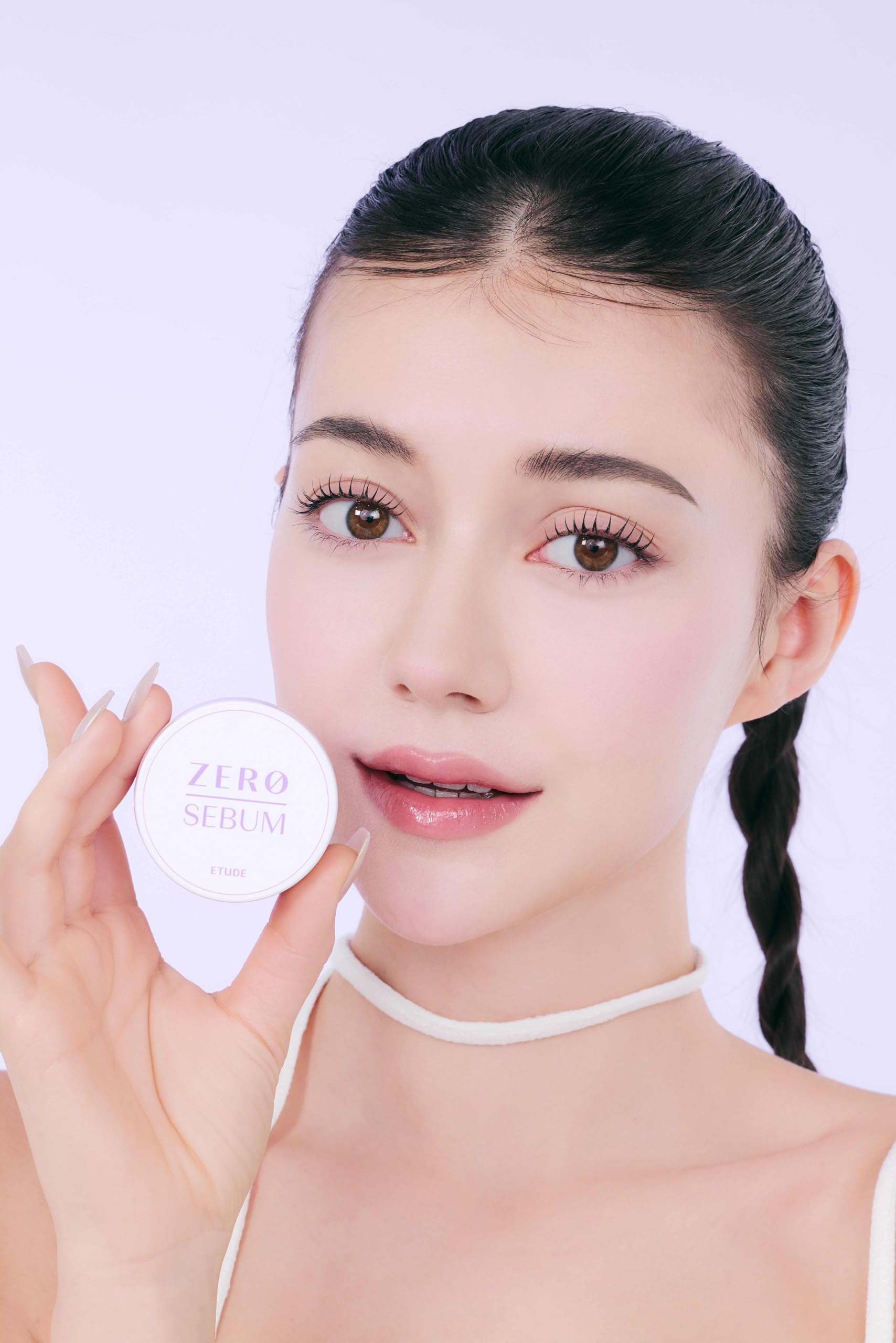 ETUDE powder tucked in a makeup bag showing daily touch-up portability