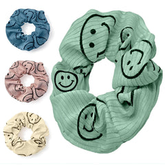 Eunoir front view of four happy face scrunchies showing colors and packaging benefit