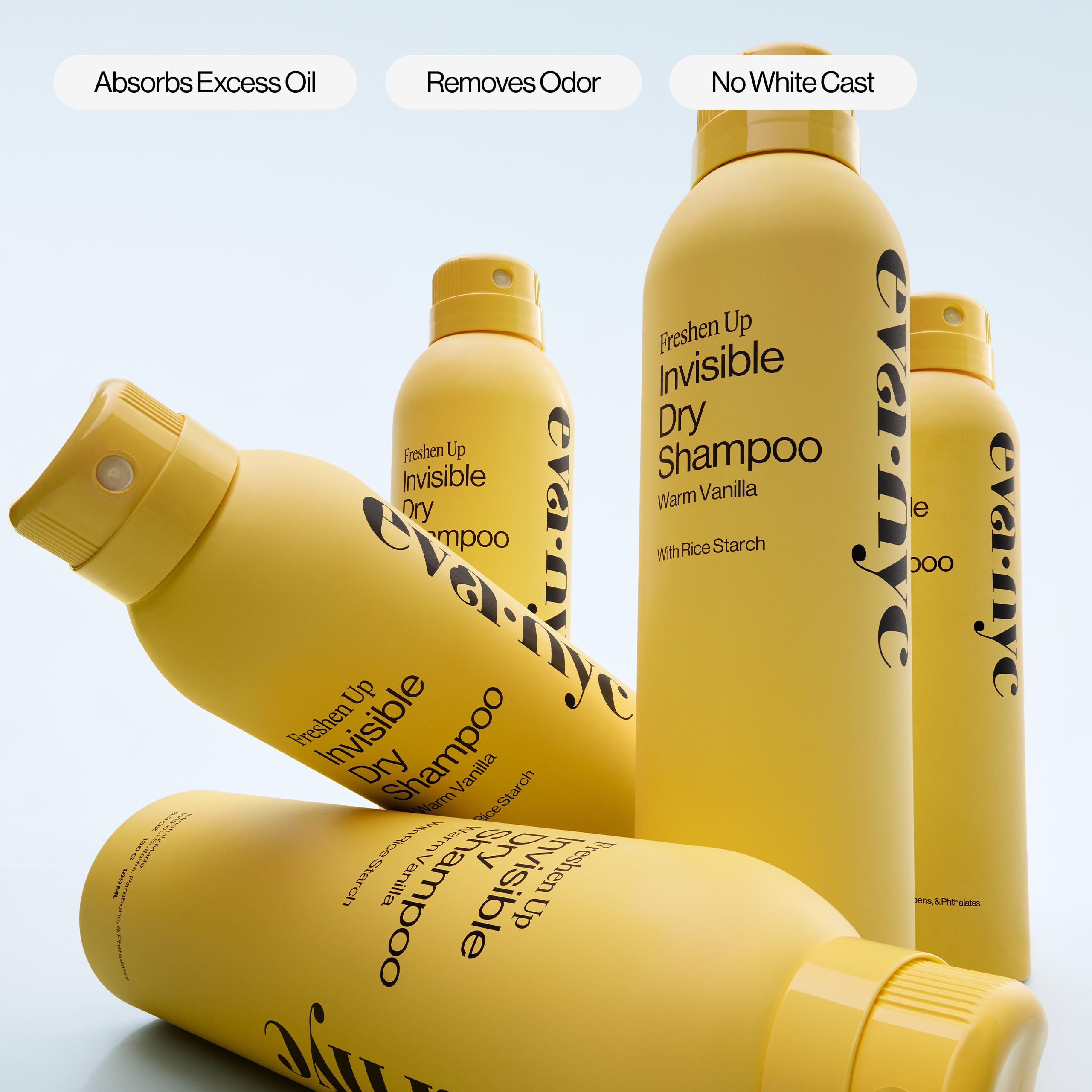 Eva NYC spray being applied to dark hair roots for oil control