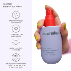 Child using Evereden detangler spray while parent gently combs hair, reduces tangles