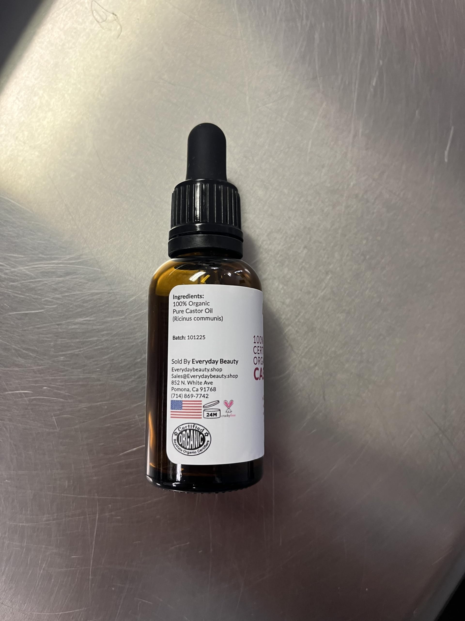 Everyday Beauty castor oil pack laid on cloth in lifestyle setting for wellness
