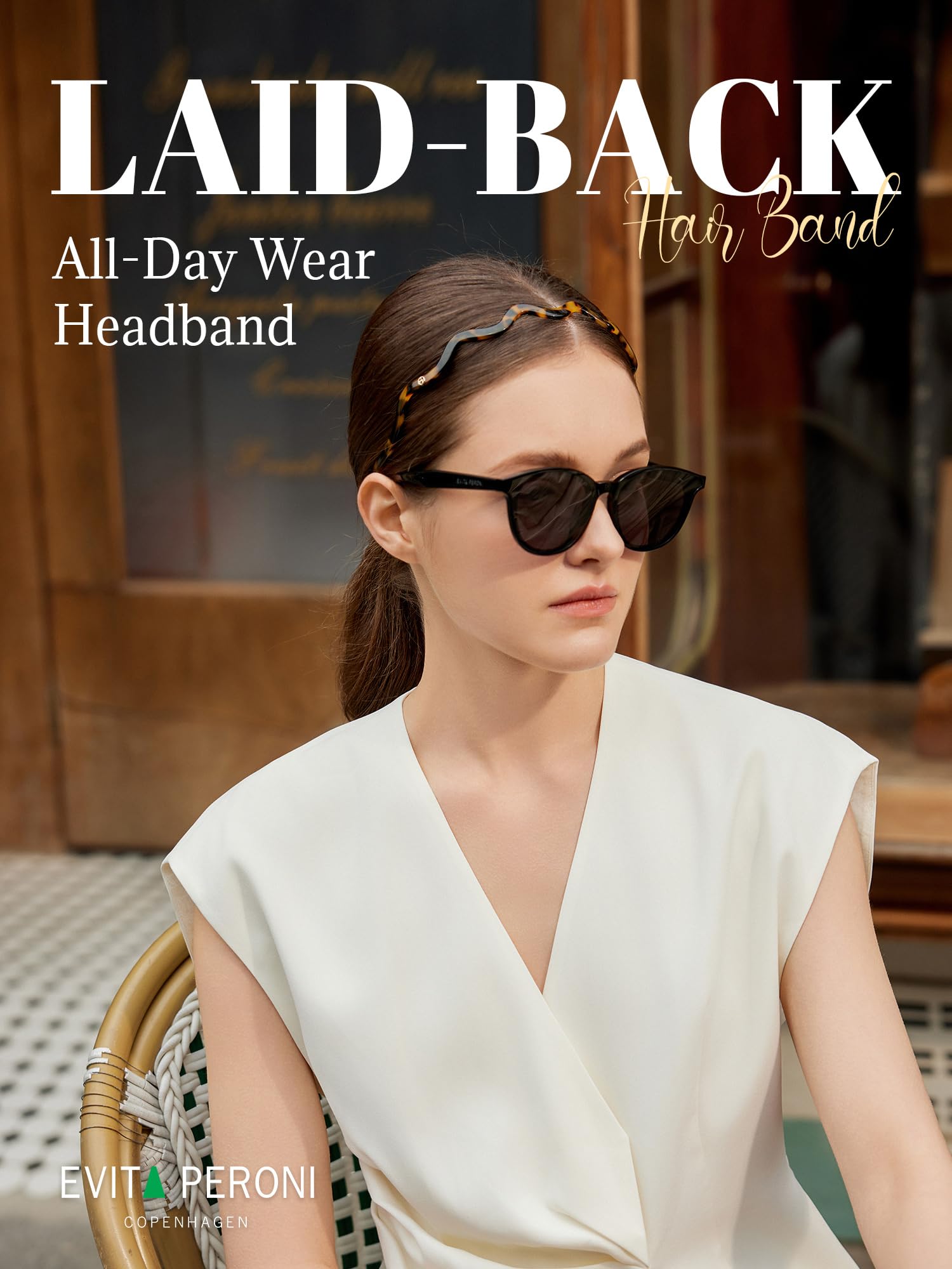 EVITA PERONI headband on hand scale showing thin, lightweight benefit