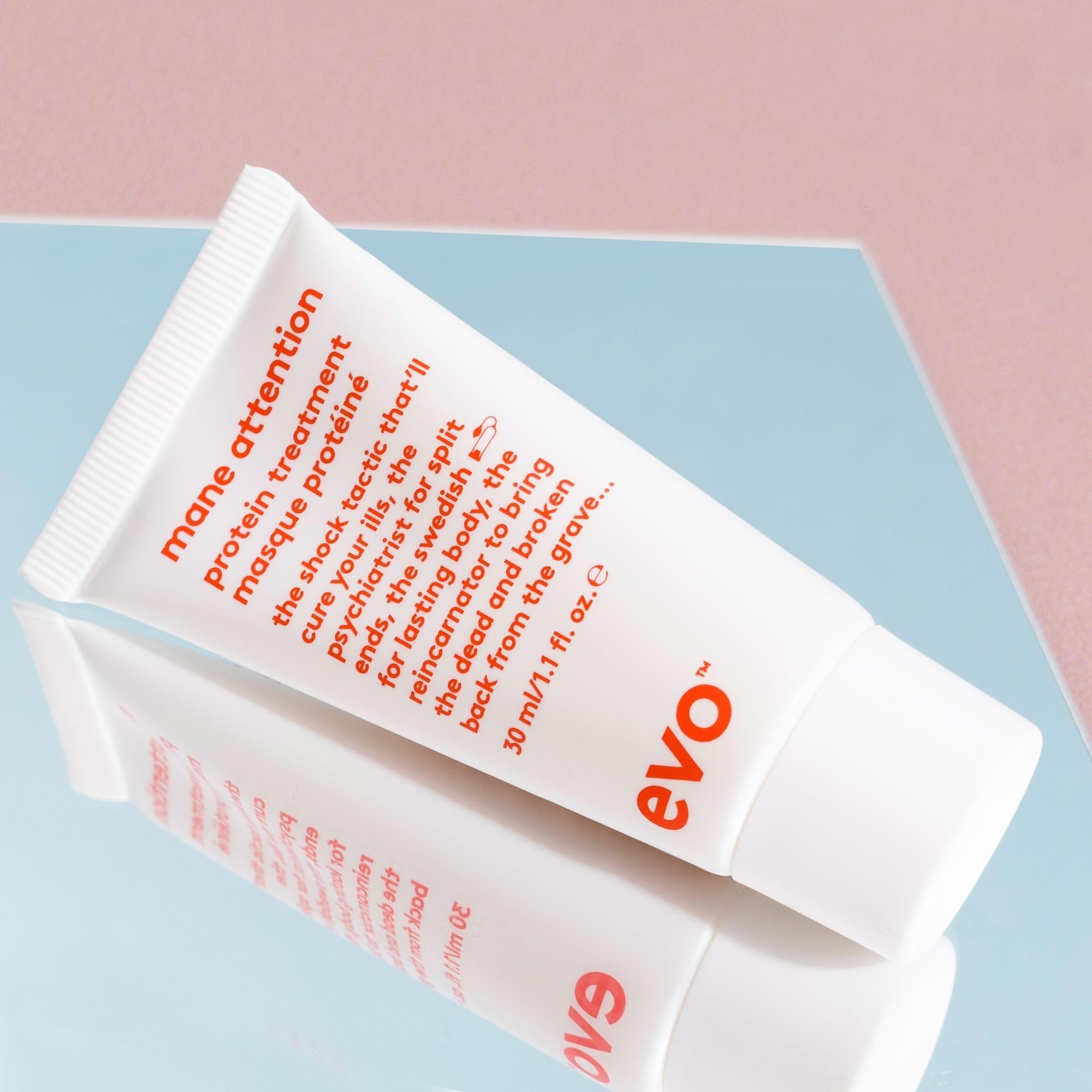 EVO application on damp hair focusing on mid-lengths to repair and detangle quickly