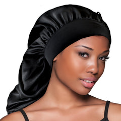 Model wearing Evolve black braid bonnet during sleep showing secure, comfortable hold