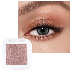 evpct close-up of Amber Rush shimmer pan, rich color payoff for brightening