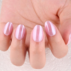evpct hand applying a press-on nail demonstrating quick at-home use