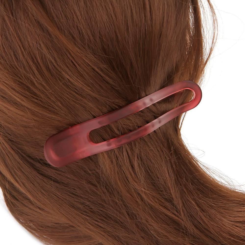 EWSNM clip holding thick hair section demonstrating strong clamp benefit