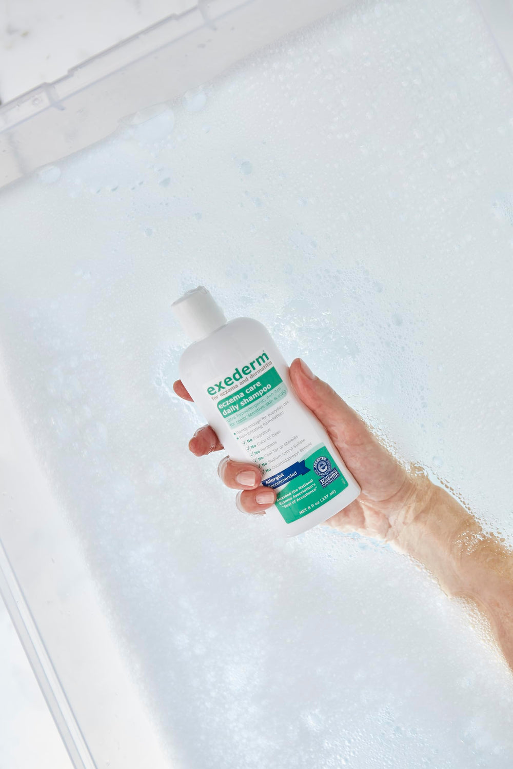 Exederm low-foam texture on hand illustrating mild cleansing